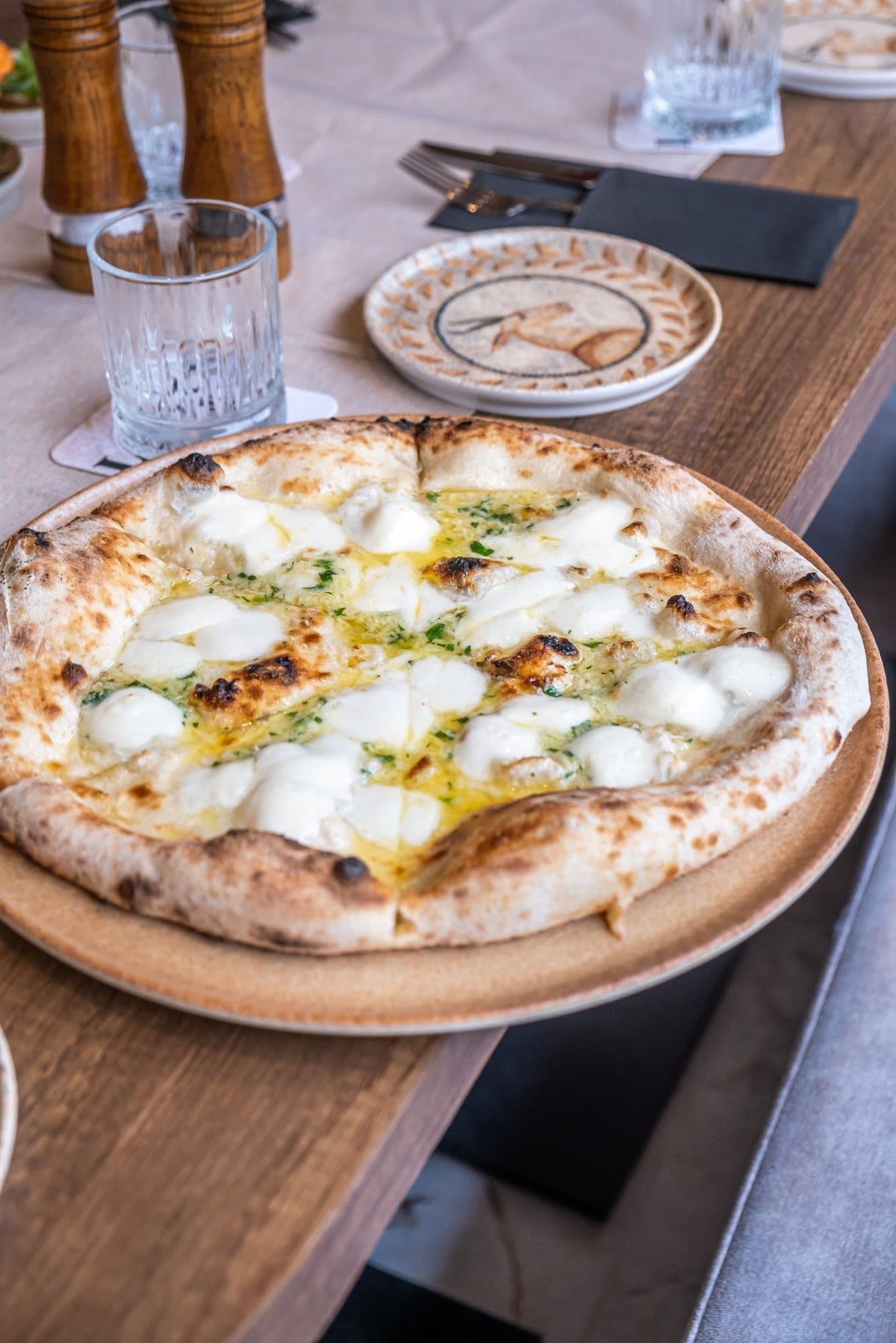Quattro Formaggi pizza, four cheeses on a white base