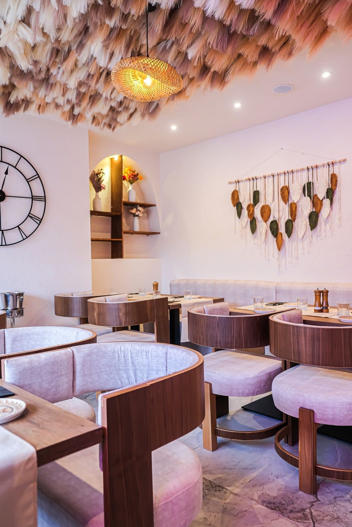 The dried-flower ceiling installation above the dining room